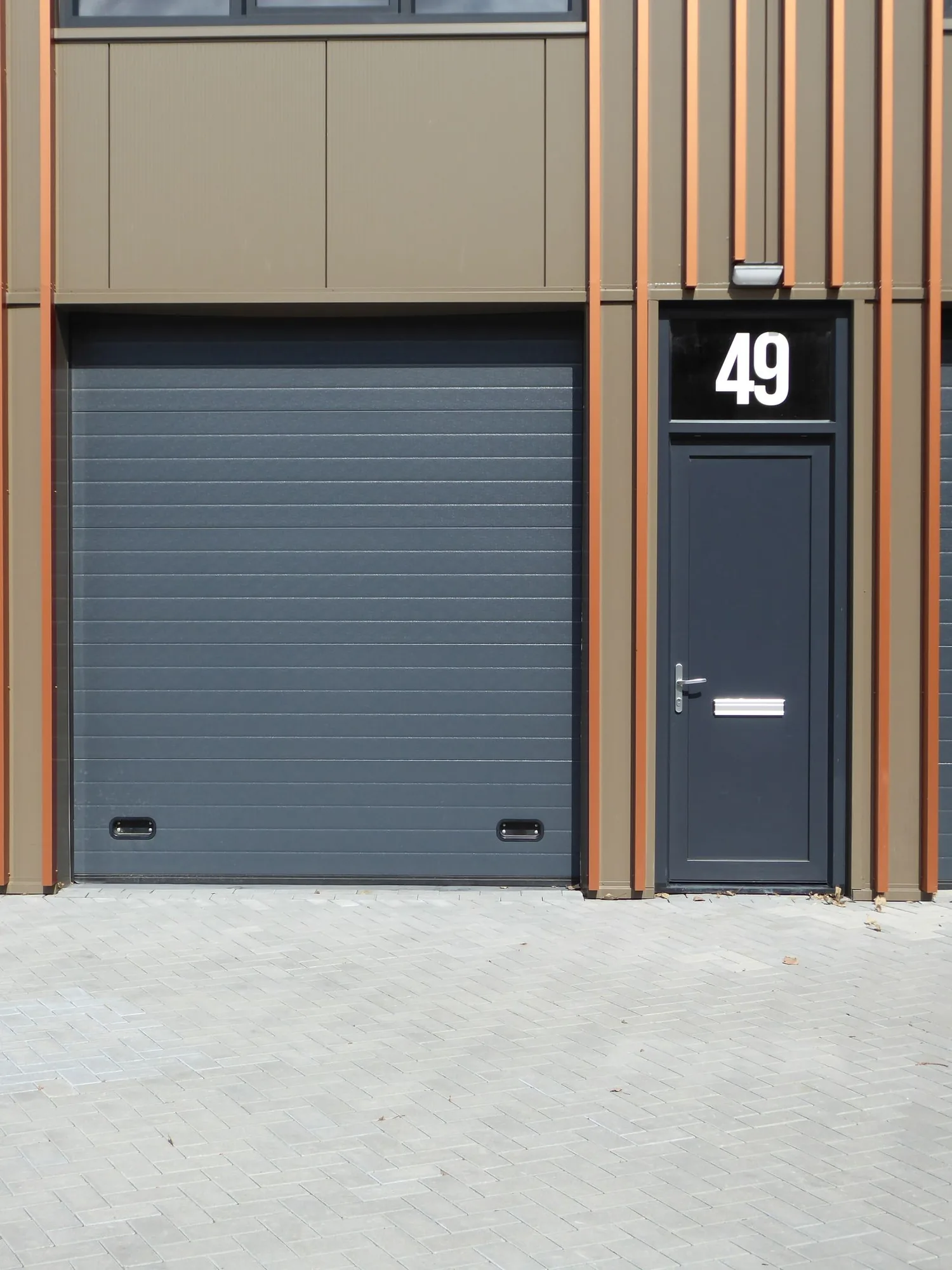 Commercial overhead door at a modern business unit